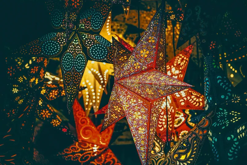 Star-shaped paper lanterns glowing in the dark