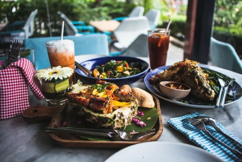 Colorful Thai seafood dinner plated outdoors, similar in style to dishes served at Long Dtai, Koh Samui