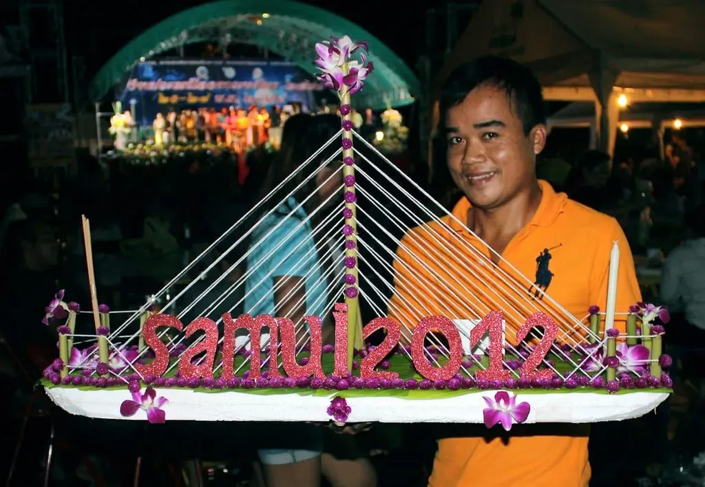 Crowd gathered on Chaweng beach Koh Samui at night for a Loy Krathong floating lantern competition