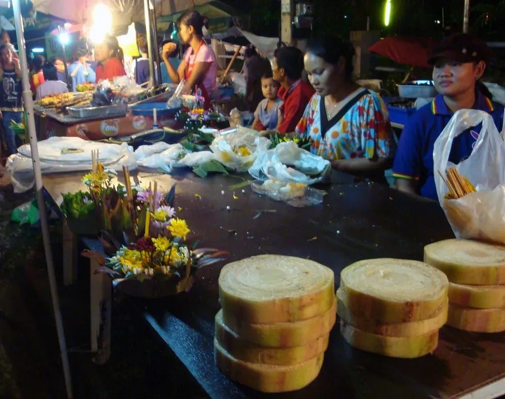 Vendors building banana-leaf krathongs by hand ahead of the Loy Krathong festival on Koh Samui