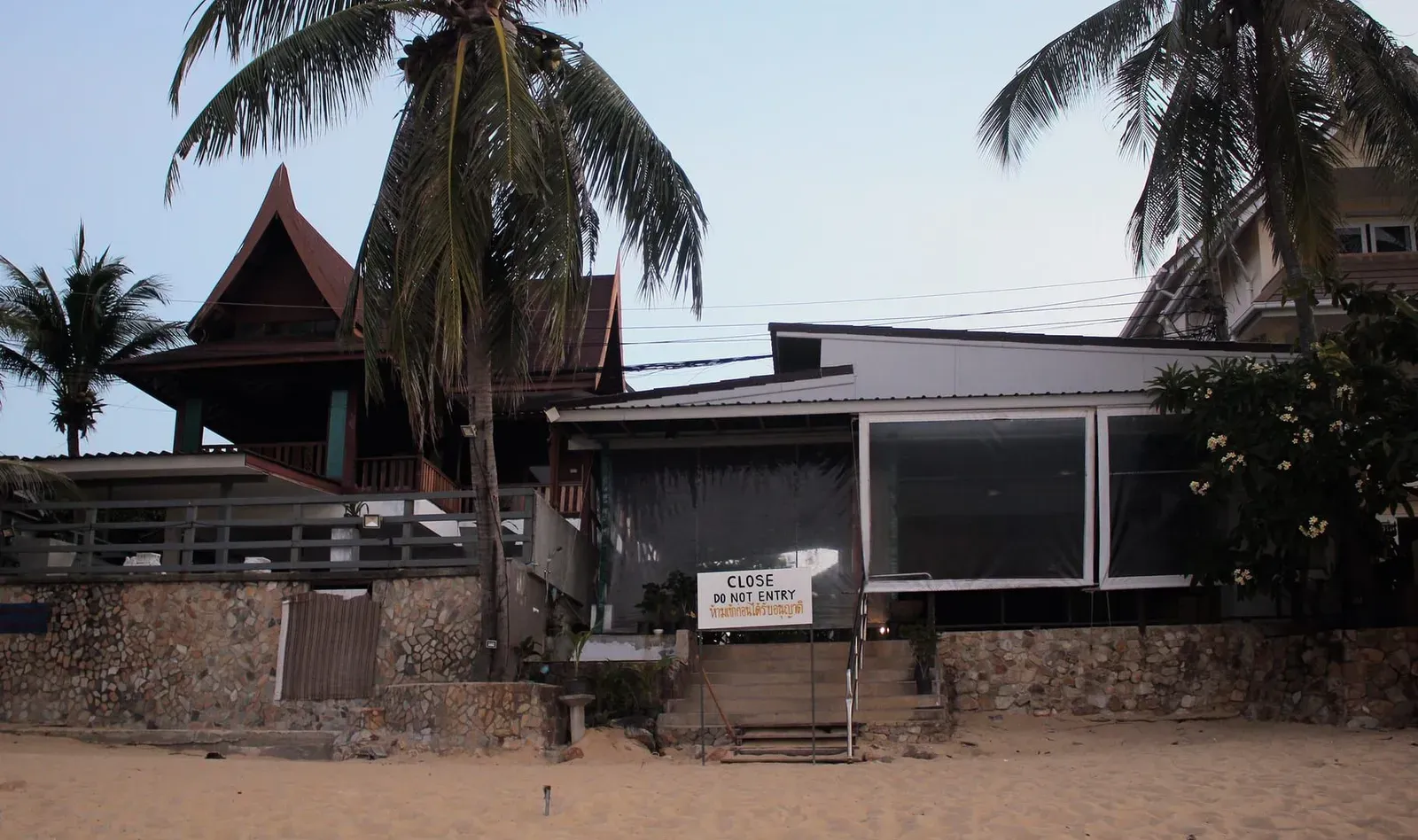 Quiet Maenam village street where a reggae-themed sunset bar keeps the sound going, Koh Samui