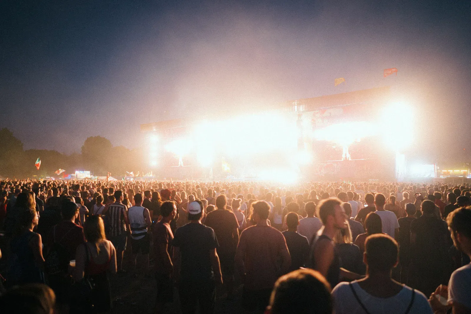 Crowd in front of a big stage at night