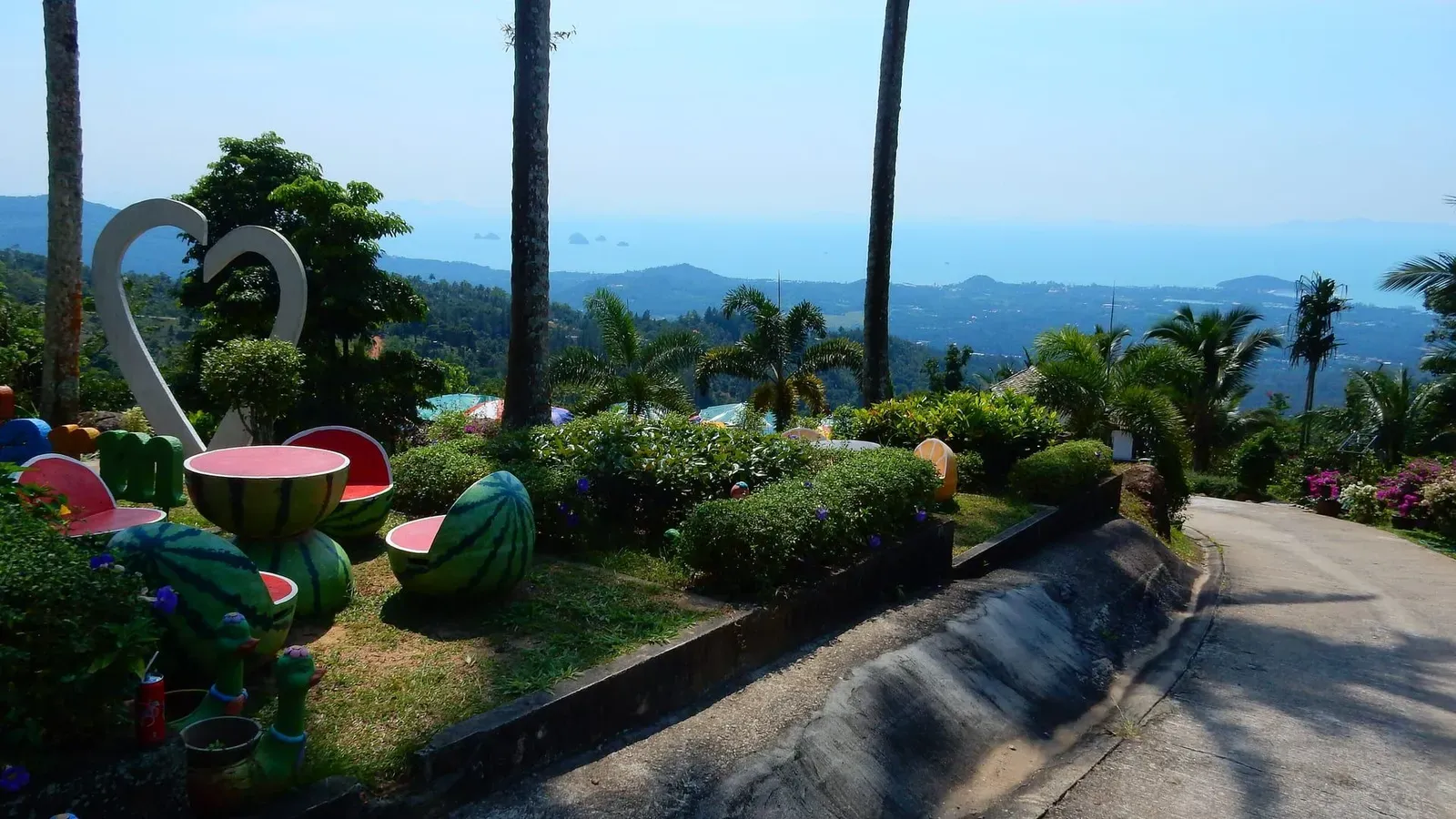 Infinity pool with loungers and umbrellas at Paradise Park Farm, a hilltop attraction above Taling Ngam Koh Samui