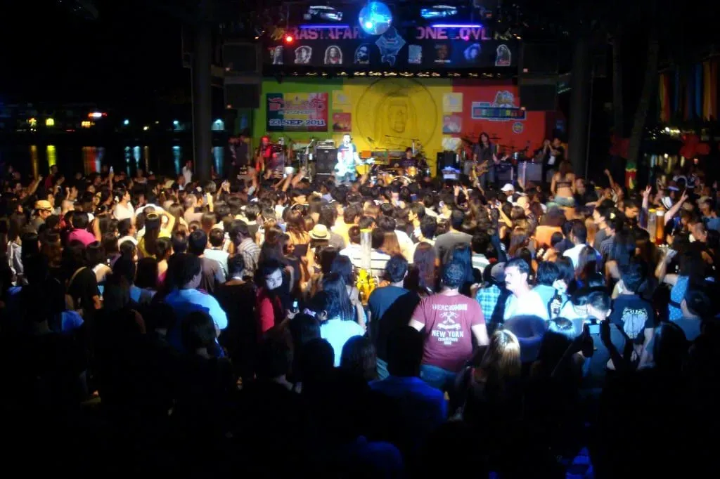 Crowd watching a live band perform on the lakeside stage at Reggae Pub, Chaweng, Koh Samui