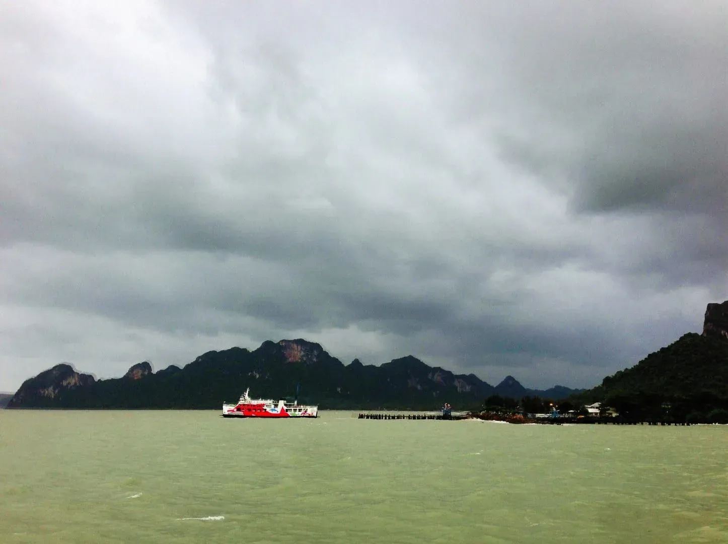 Ferry crossing choppy water between Surat Thani and Koh Samui under a cloudy sky