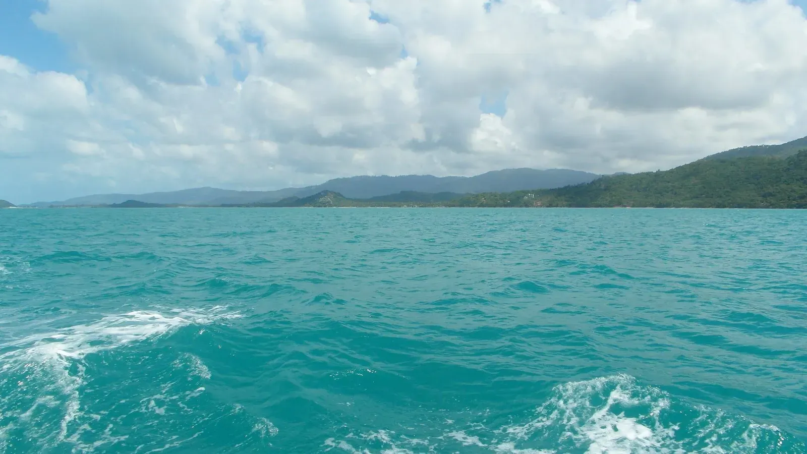Two small forested islands off Koh Samui's southwest coast, seen from the water near Taling Ngam