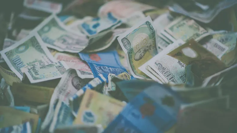 Soft-focus view of banknotes symbolizing the cost of a Koh Samui holiday