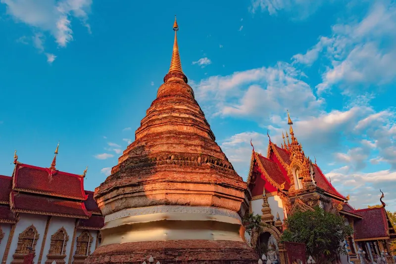 Traditional Buddhist temple against a blue sky in Chiang Mai on this Thailand 2 weeks itinerary