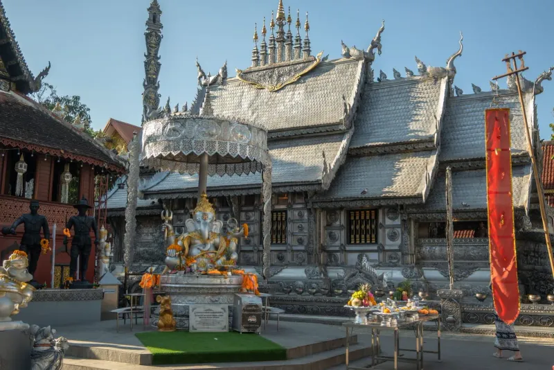 Silver temple with a Buddha statue showcasing exquisite Thai architecture in Chiang Mai