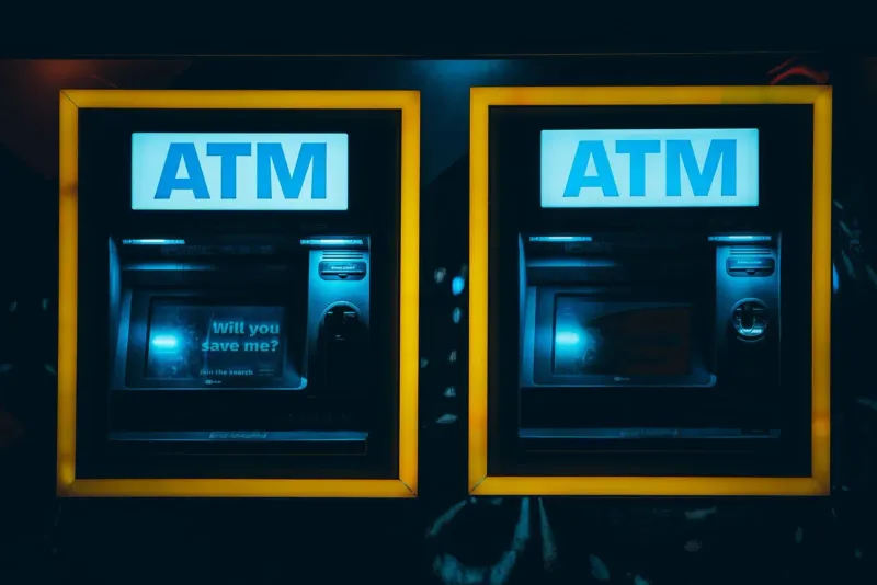 Illuminated ATM machines at night for currency withdrawals in Thailand