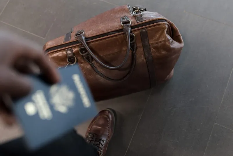 Travel bag and passport packed for a Koh Samui trip requiring a Thailand digital arrival card