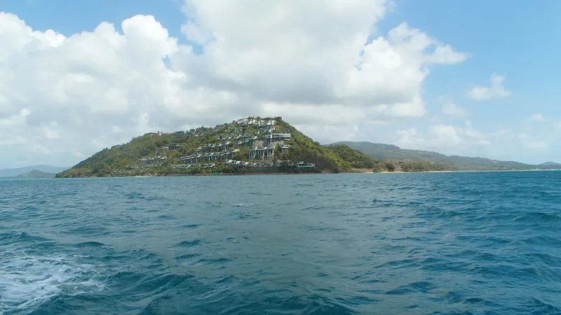 Wide view of the southwest Koh Samui headland from the water, above Thong Tanote and Phang Ka