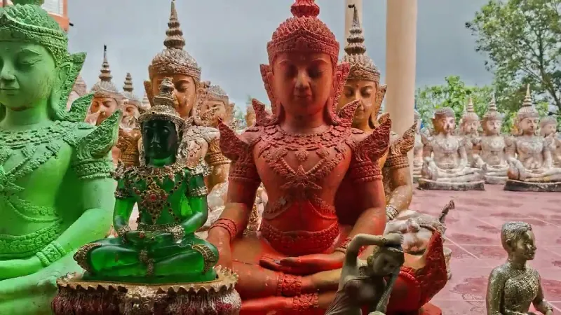 Colourful statues within the Wat Teepangkorn temple grounds