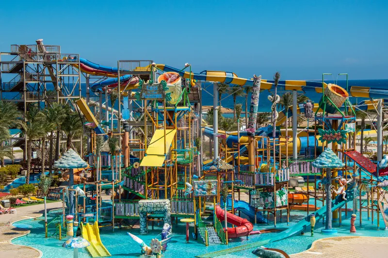 A water park with colourful slides and pools, generic illustration of the kind of rides Samui Water Park offers