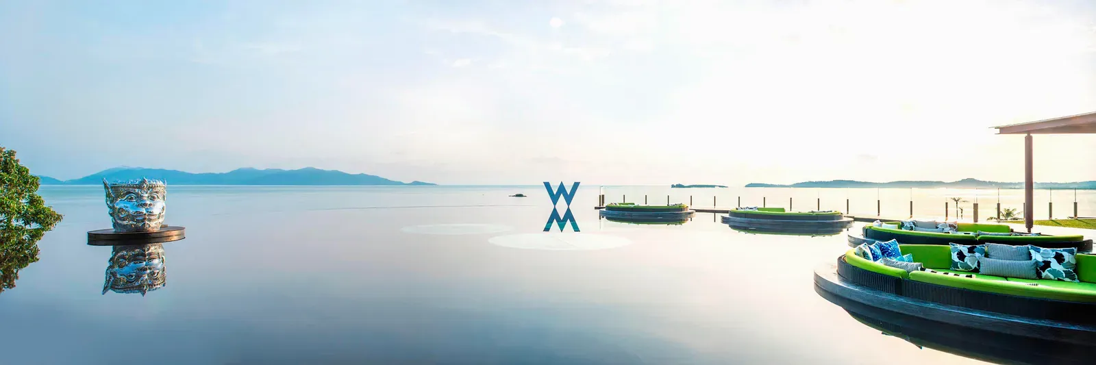 WOOBAR's infinity pool at W Koh Samui with round daybed platforms and a calm view over the Gulf of Thailand