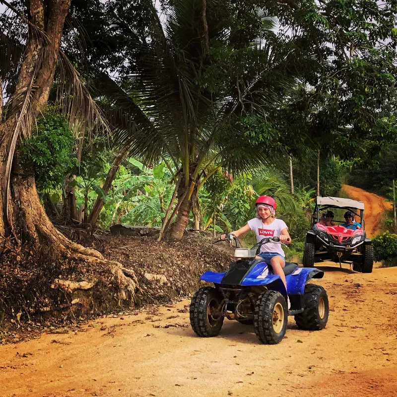 Quad bike rider on X-Quad Samui's off-road tour, booked through the Pelago activity platform
