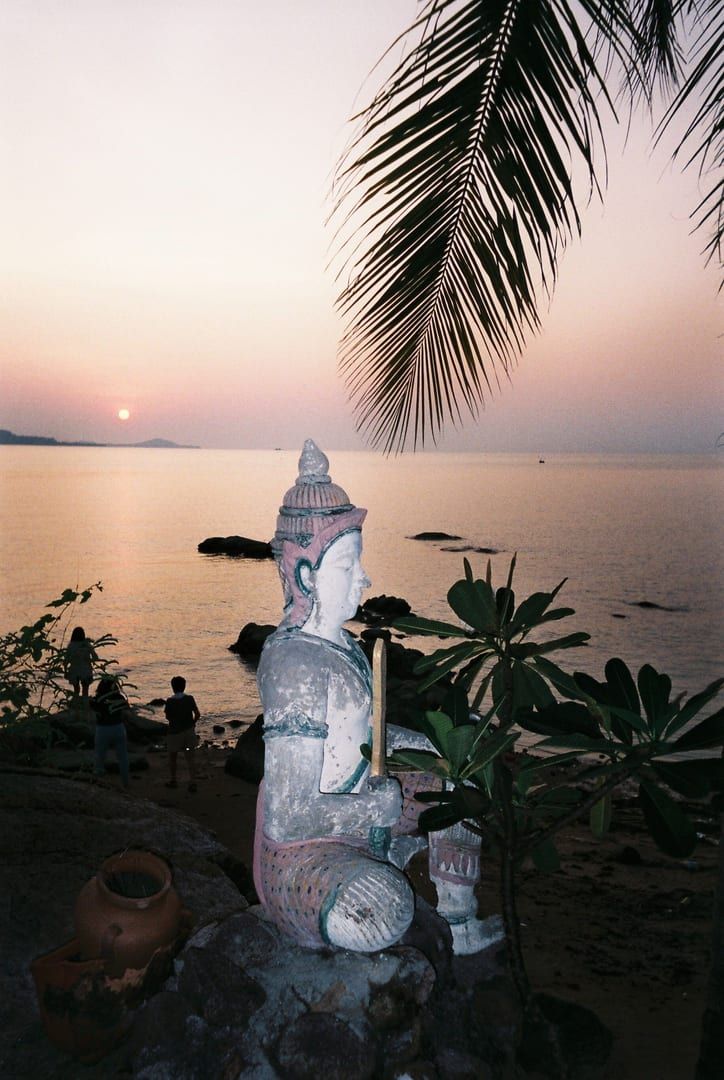 Buddha statue by the sea at sunrise near Bang Po Beach Koh Samui