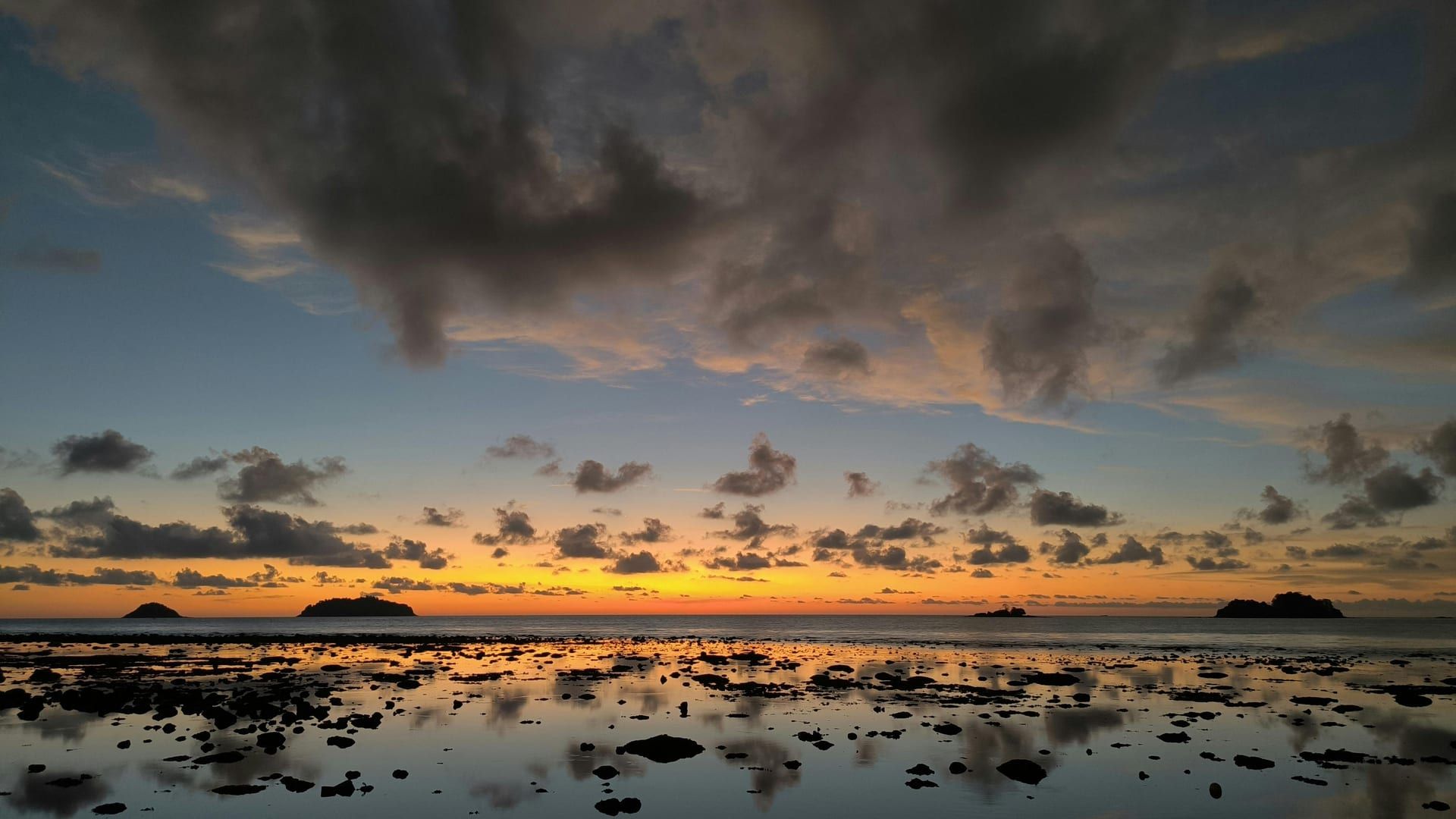Dramatic sunset clouds over Koh Samui with calm sea reflections at Lipa Noi