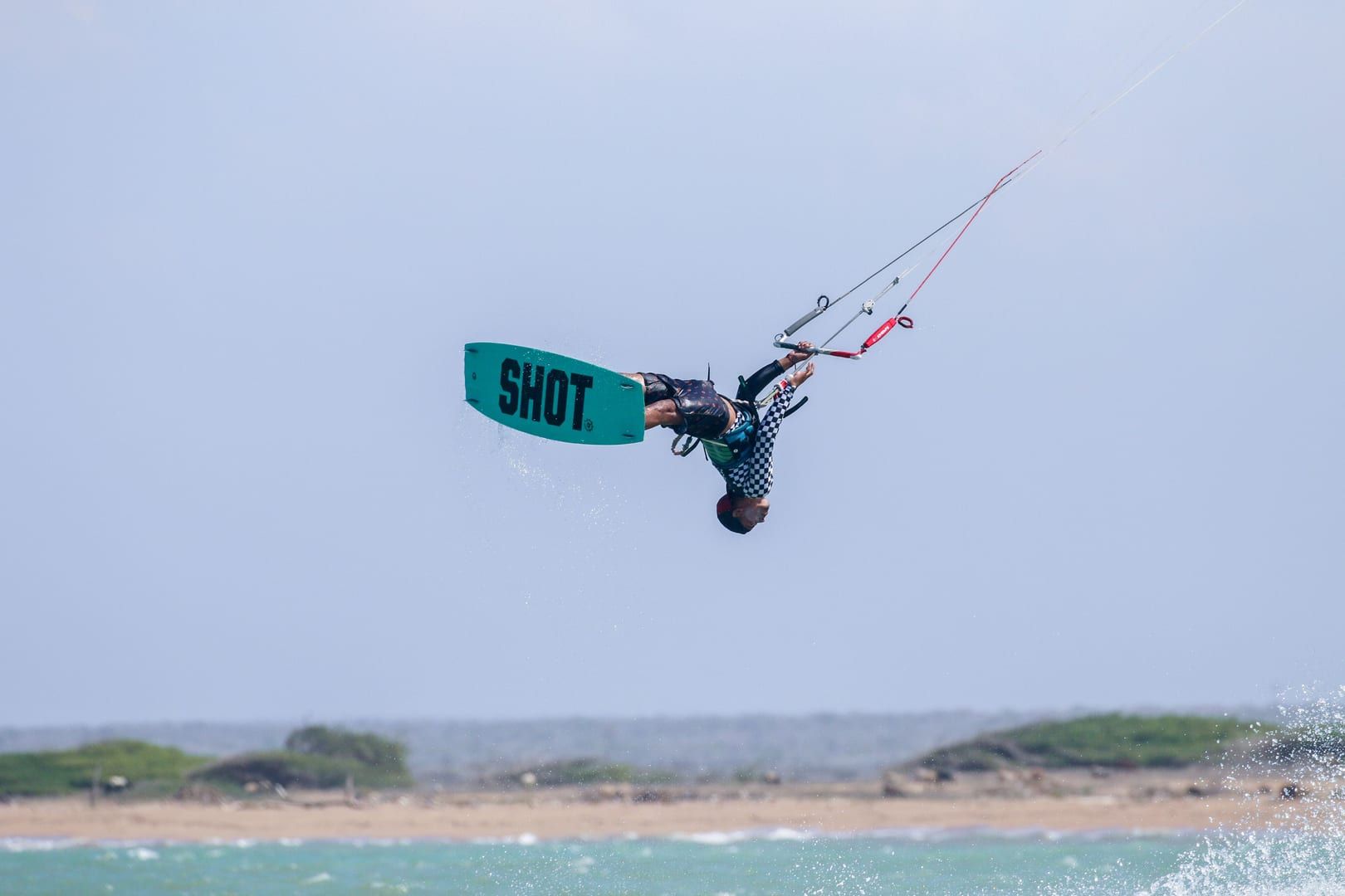 Kitesurfing action mid-air over the reef-protected waters of Na Khai Beach Koh Samui