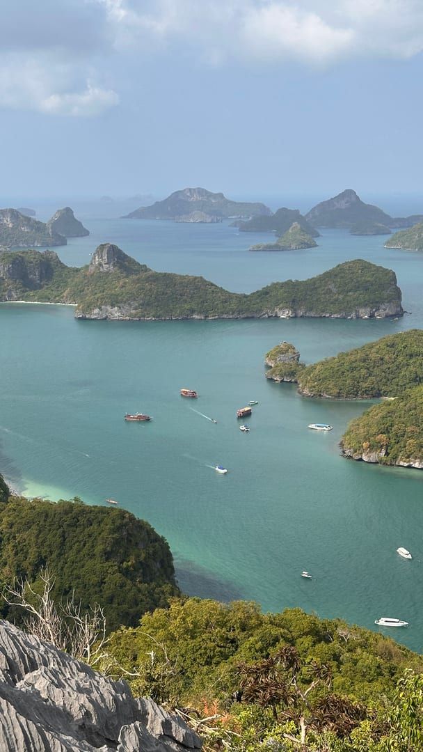 Aerial view of emerald green water and jungle-covered islands at Ang Thong National Marine Park