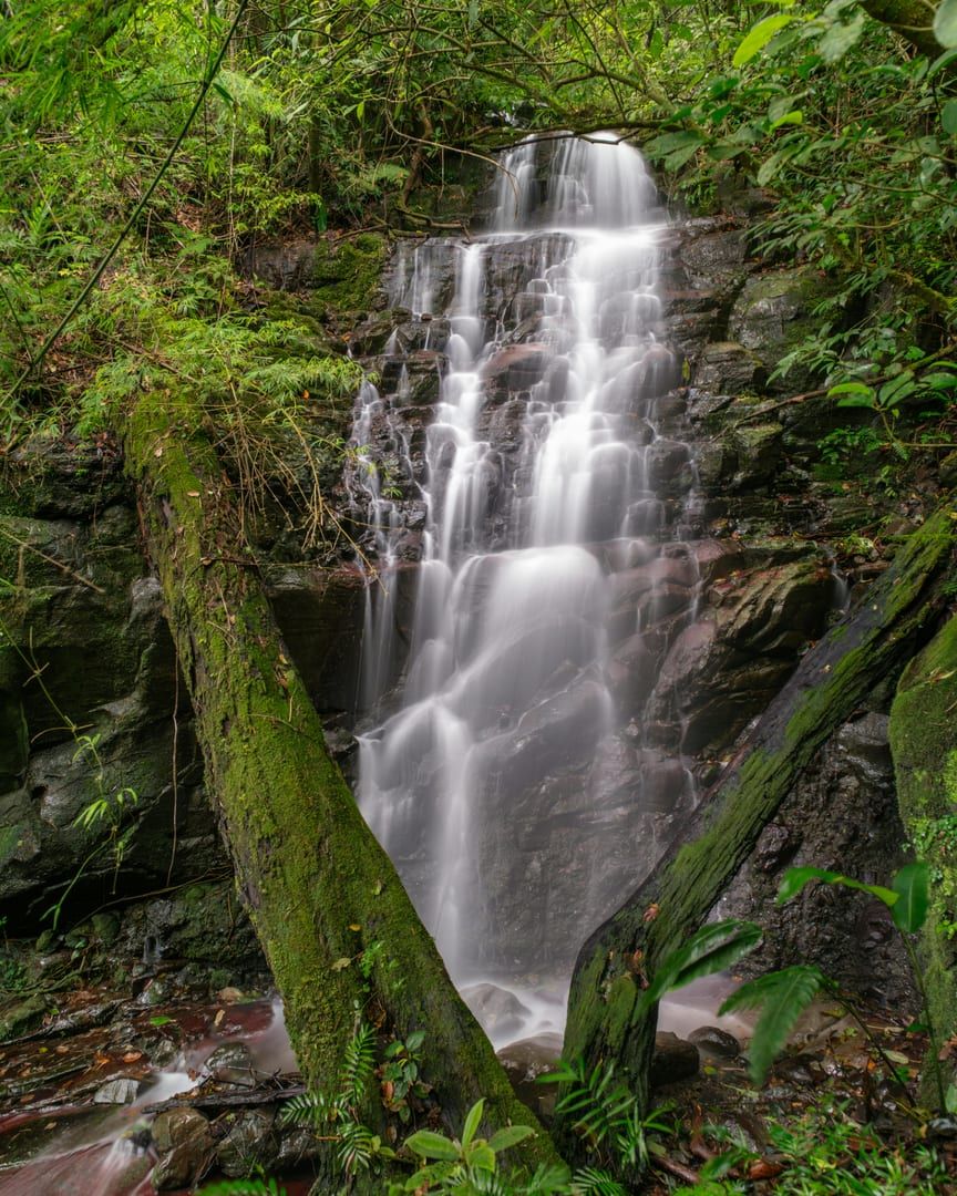 Majestic waterfall in lush tropical forest on Na Muang waterfalls hike Koh Samui