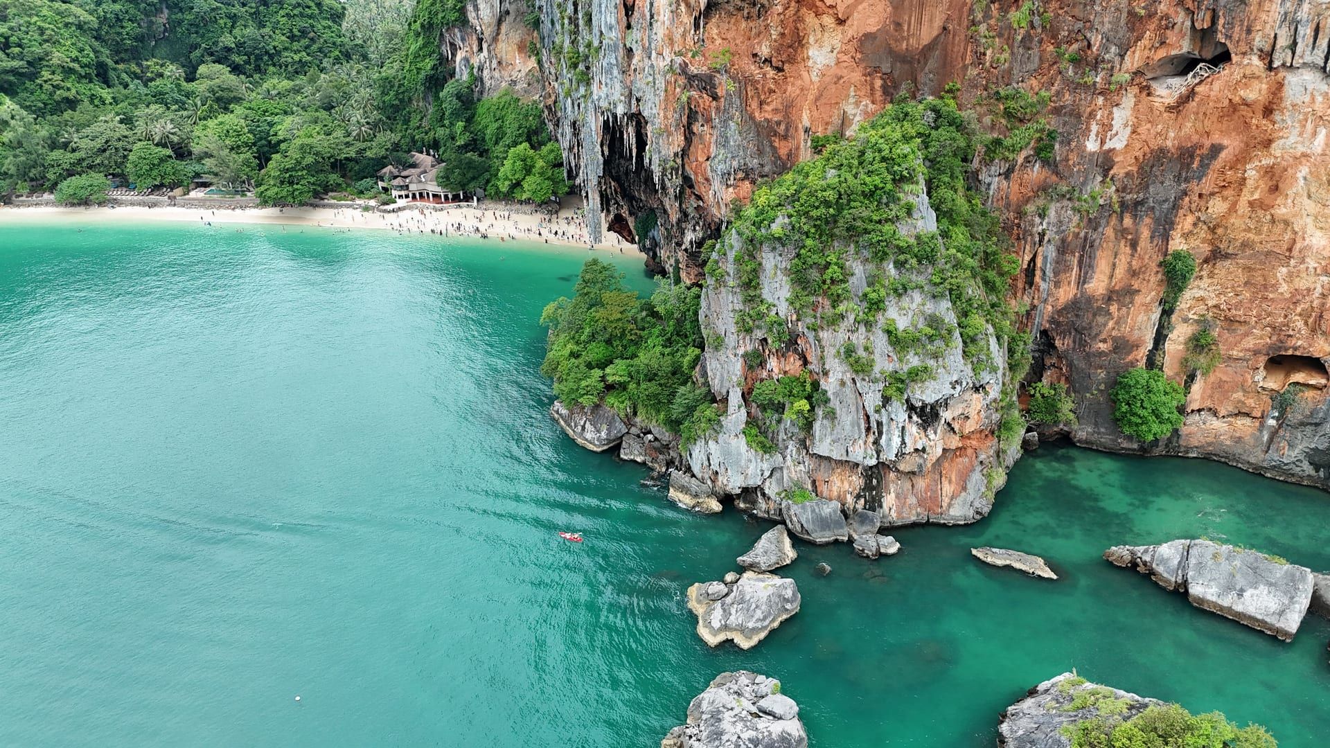 Aerial coastal panorama with turquoise water and granite headlands near Koh Samui