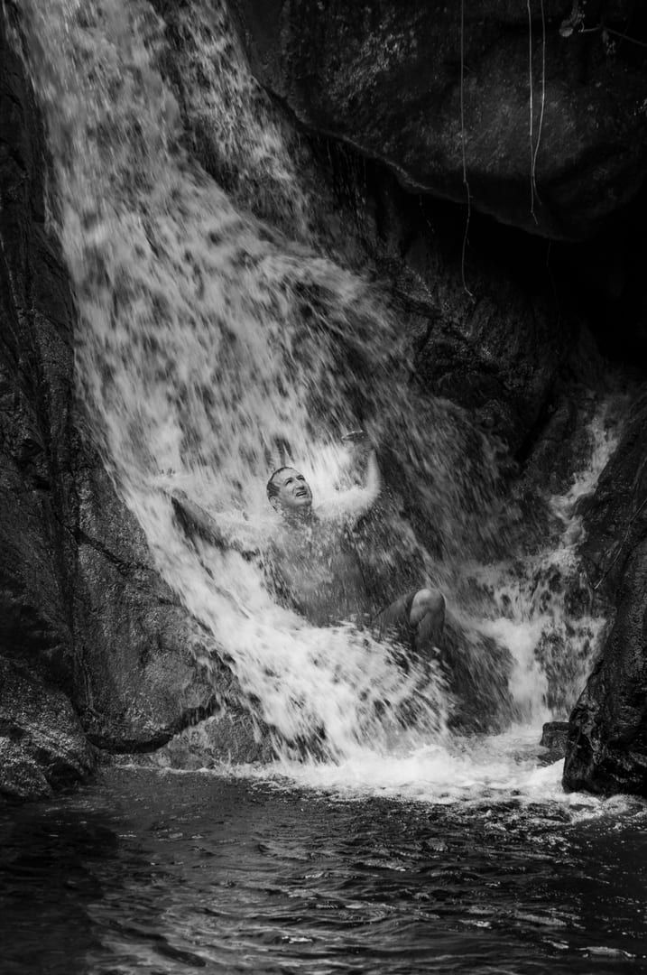 Local guide with bamboo walking sticks