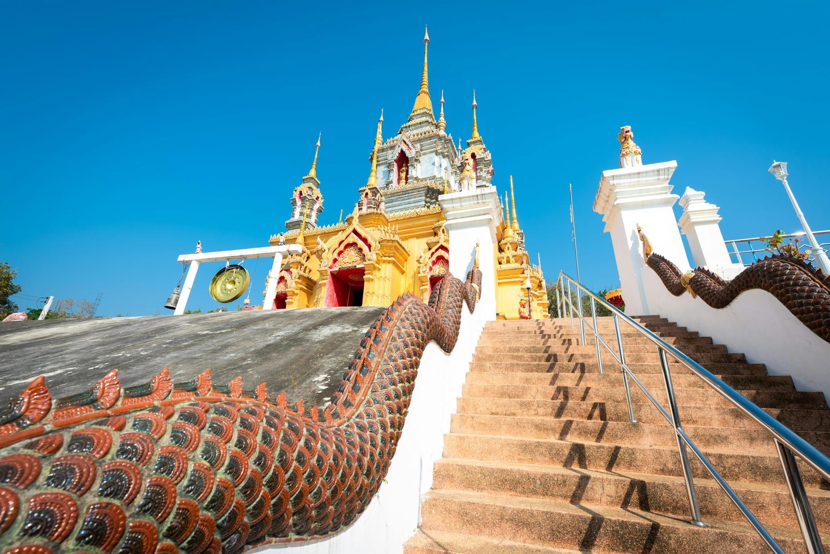 Overview of the lush Wat Hin Lad temple grounds