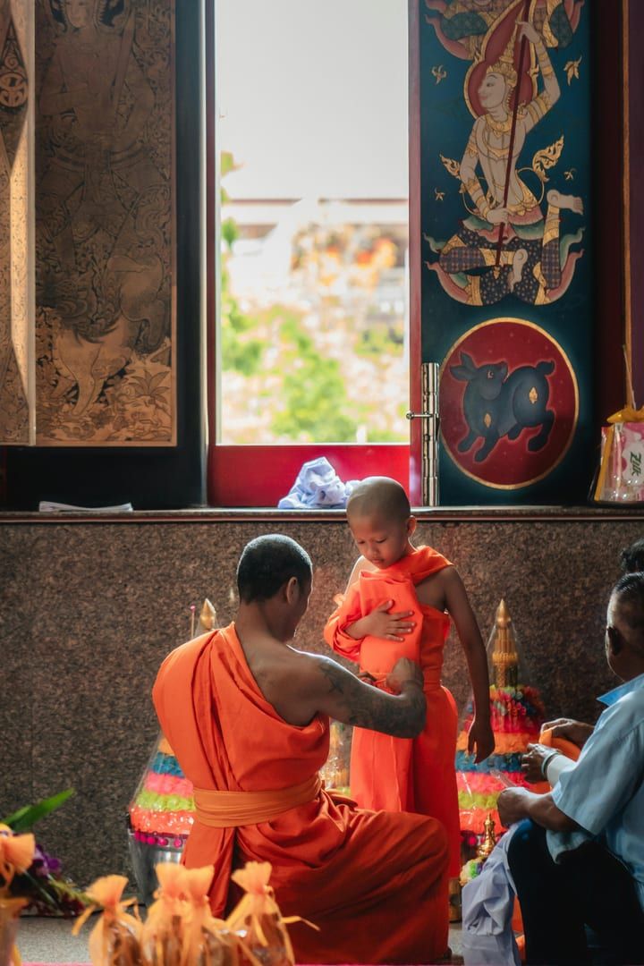 Offering incense at the meditating monk's shrine