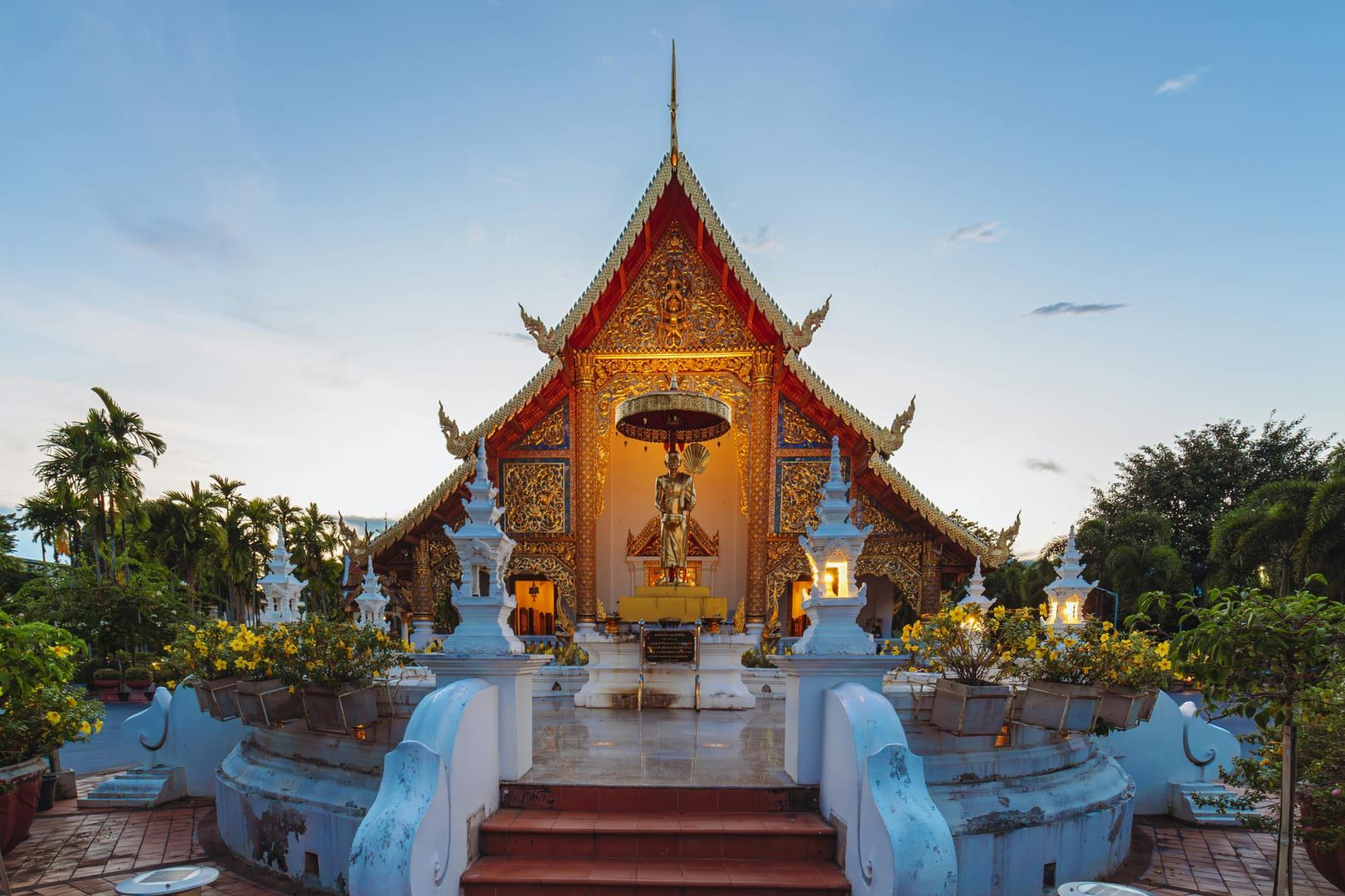 Golden Buddha statue and sacred well area at Wat Na Phra Lan Samui