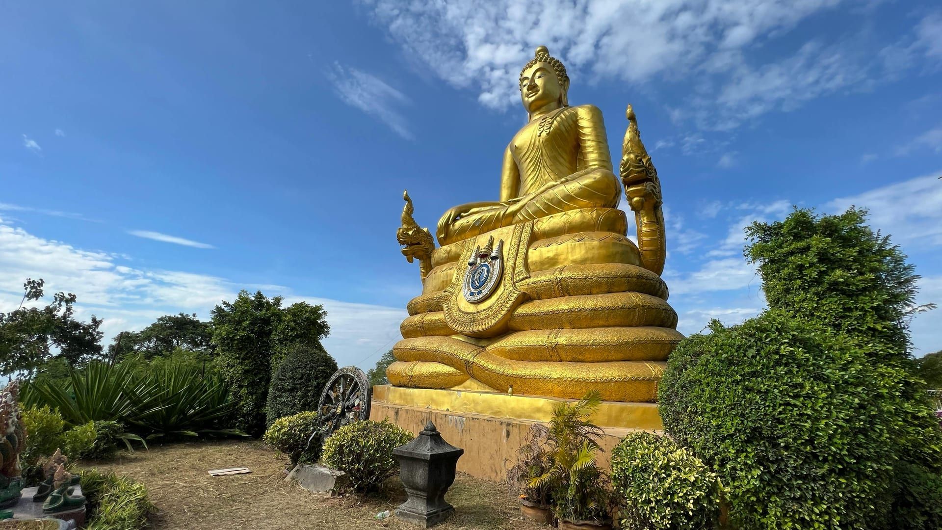 Stunning golden Buddha under blue sky at Koh Samui temple