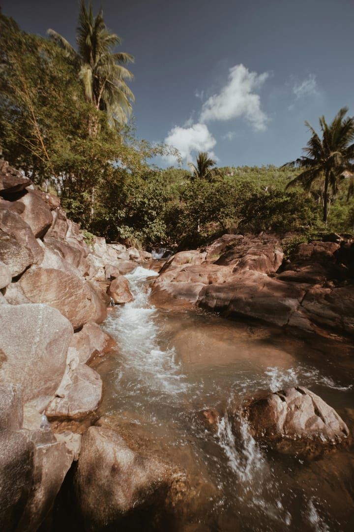 Tropical river flowing through rocky terrain on the Hin Lad waterfall trail Koh Samui
