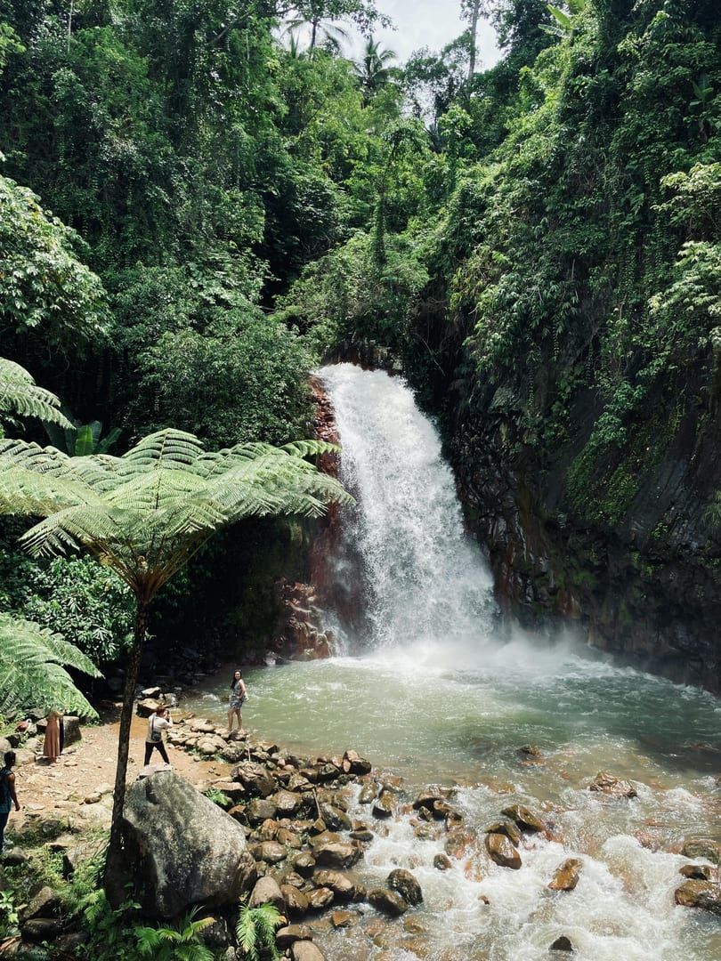 Waterfall flowing over dark granite rocks