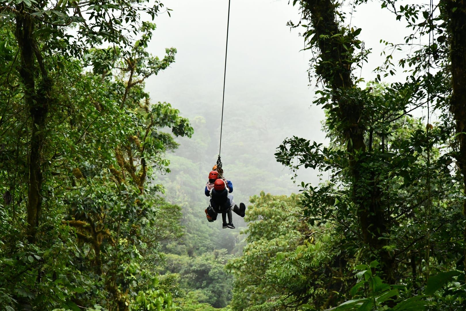 Aerial view of the dense Maenam jungle surrounding Tan Rua Waterfall