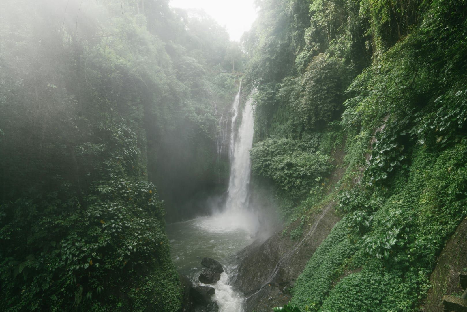 Water rushing over boulders at Tan Rua Waterfall