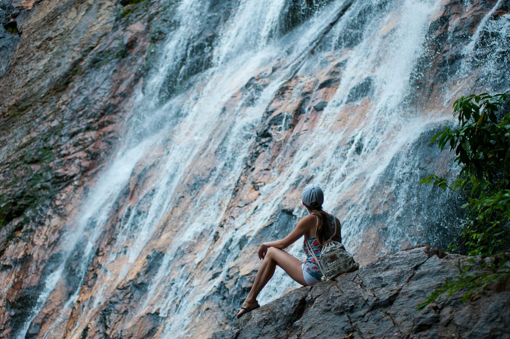 Cascading waterfall in Secret Buddha Garden sculpture park Samui